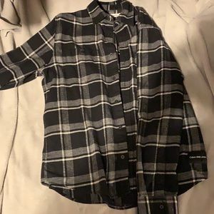 A long sleeve Calvin Klein Jeans shirt, size M